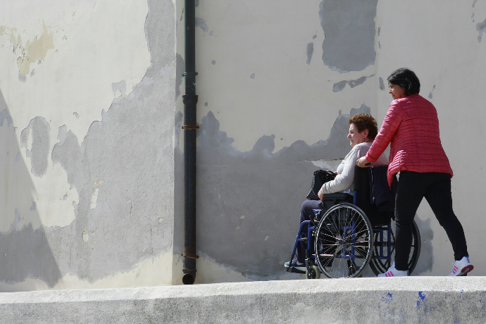 woman sitting on gray wheelchair